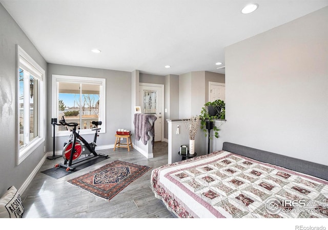 bedroom featuring recessed lighting, wood finished floors, and baseboards