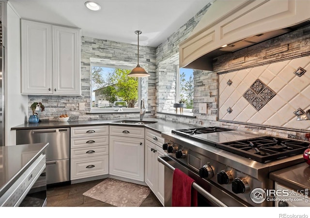 36340 County Road 49, Eaton, CO 80615 - kitchen with appliances with stainless steel finishes, backsplash, dark countertops, white cabinets, and recessed lighting