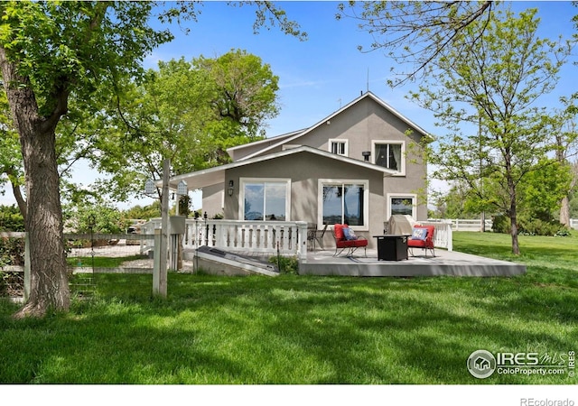 36340 County Road 49, Eaton, CO 80615 - rear view of property featuring stucco siding and a patio area