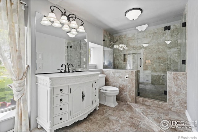 36340 County Road 49, Eaton, CO 80615 - full bath with vanity, a shower stall, and marble finish flooring