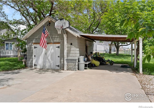 36340 County Road 49, Eaton, CO 80615 - view of outbuilding featuring a carport and driveway