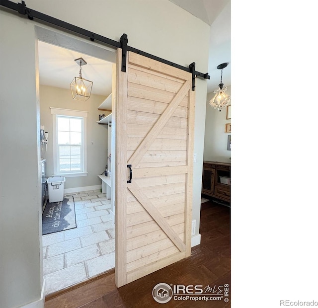 bathroom featuring wood finished floors and baseboards