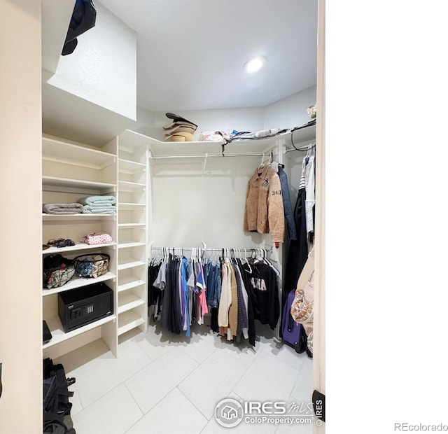 walk in closet featuring tile patterned floors