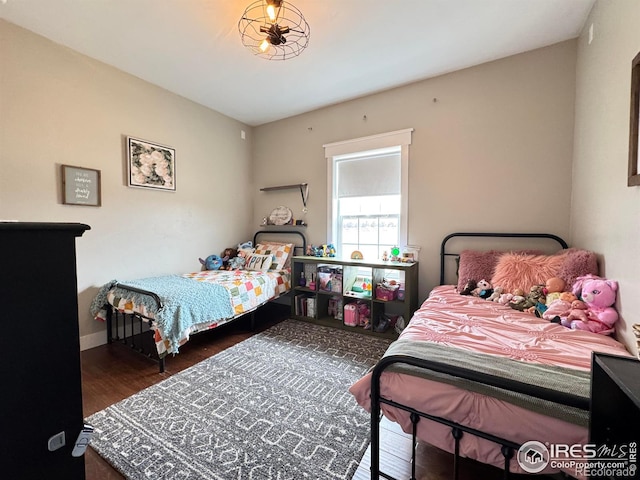 bedroom with wood finished floors