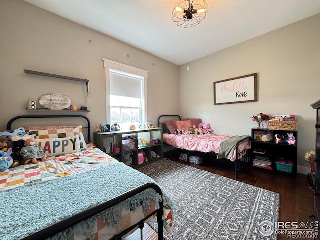 bedroom with wood finished floors