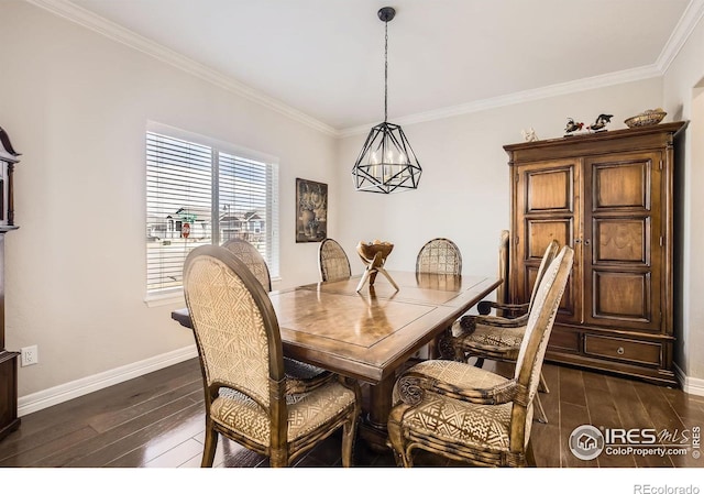 dining area with dark wood-style flooring, an inviting chandelier, and baseboards