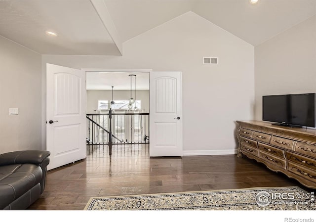 living area with lofted ceiling, recessed lighting, visible vents, wood finished floors, and baseboards