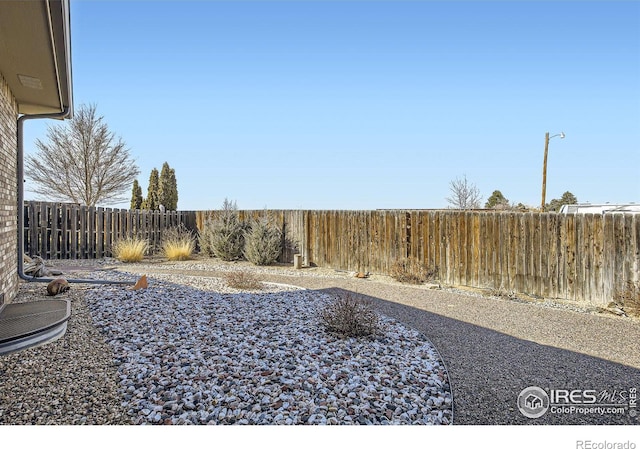 view of yard featuring a fenced backyard