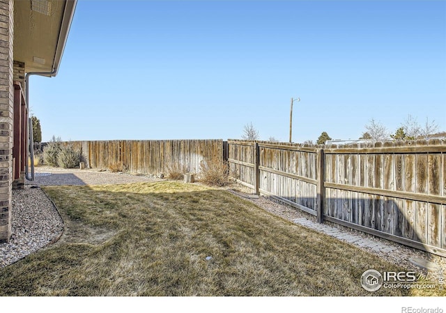 view of yard featuring a fenced backyard