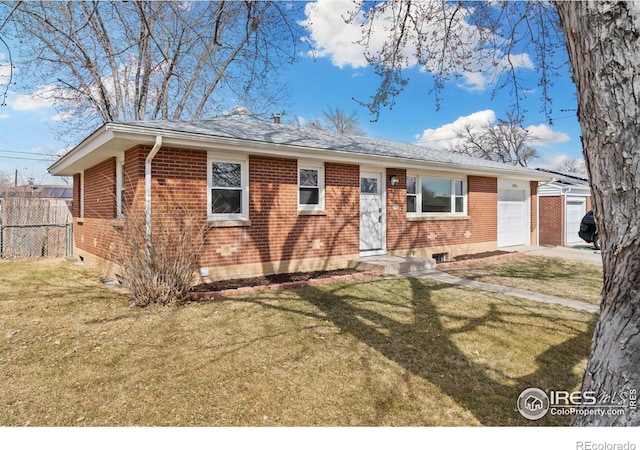 ranch-style home with a garage, brick siding, fence, and a front lawn