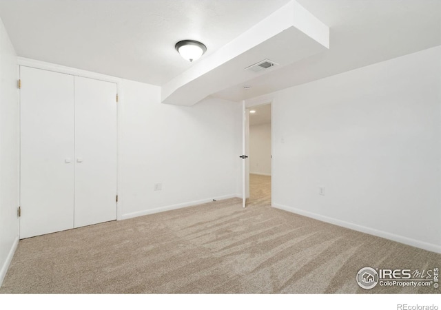 unfurnished bedroom with baseboards, visible vents, and carpet flooring