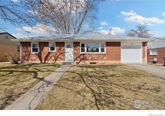 ranch-style house with an attached garage, driveway, a front lawn, and brick siding