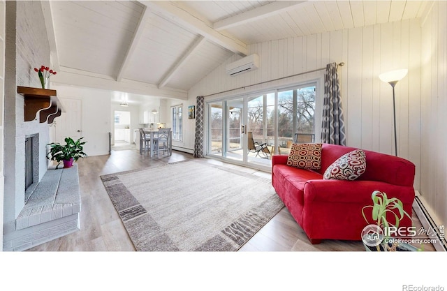 living room featuring vaulted ceiling with beams, a fireplace, wood finished floors, and a wall mounted AC