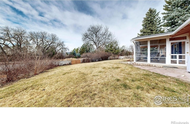 view of yard with a sunroom