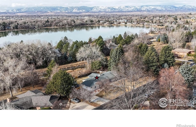 aerial view featuring a water and mountain view