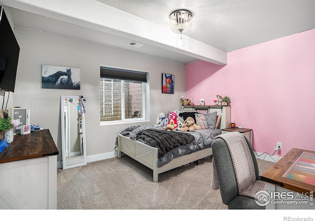 carpeted bedroom featuring visible vents, a textured ceiling, and baseboards