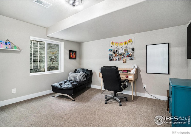 office space with carpet, visible vents, and baseboards