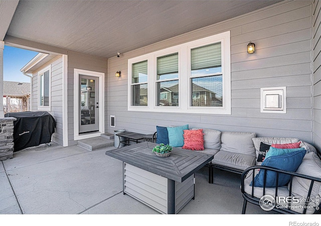 view of patio with a grill and an outdoor living space