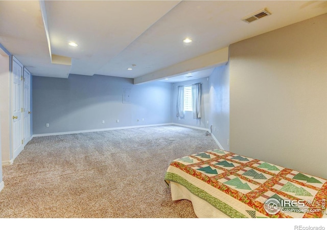 unfurnished bedroom with visible vents, recessed lighting, baseboards, and carpet