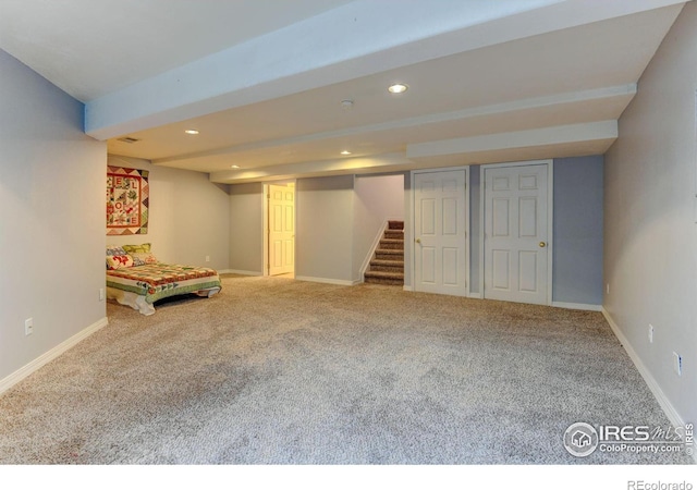 finished basement with stairway, recessed lighting, carpet, and baseboards