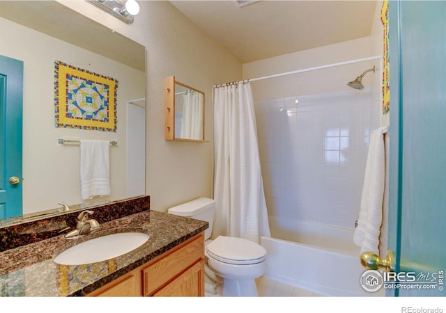 full bath featuring tile patterned floors, toilet, vanity, and shower / bath combination with curtain