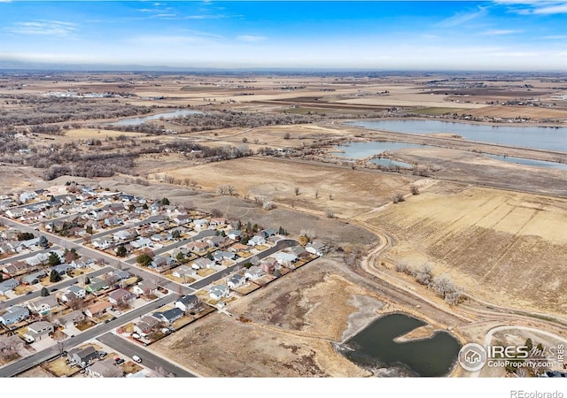 bird's eye view with a residential view and a water view