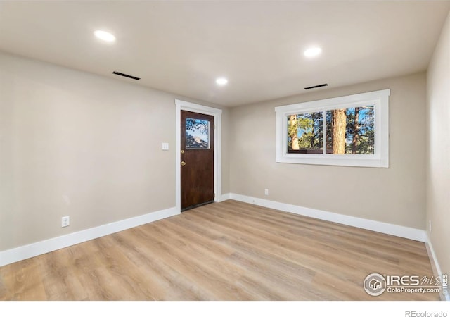 entrance foyer featuring recessed lighting, light wood-style floors, visible vents, and baseboards