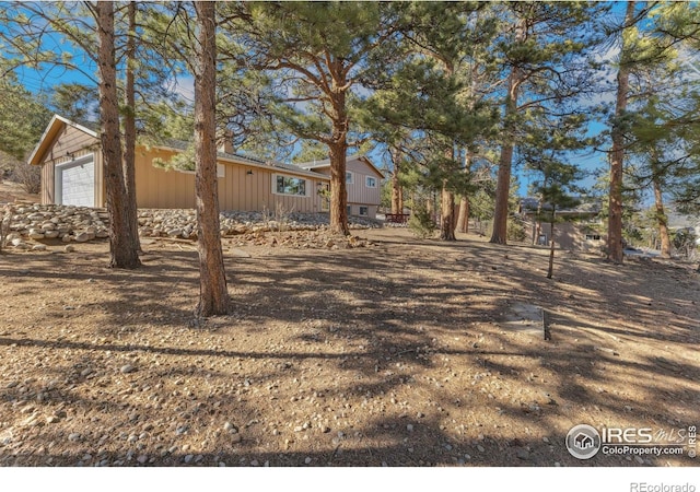 1059 Lexington Ln, Estes Park, CO 80517 - view of yard featuring a garage