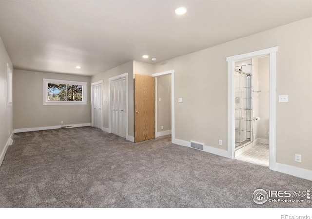 1059 Lexington Ln, Estes Park, CO 80517 - unfurnished bedroom with recessed lighting, carpet, baseboards, multiple closets, and ensuite bathroom