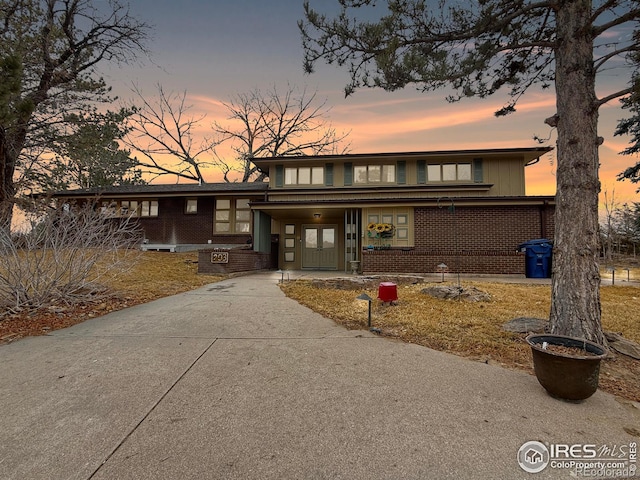 view of front of home featuring brick siding