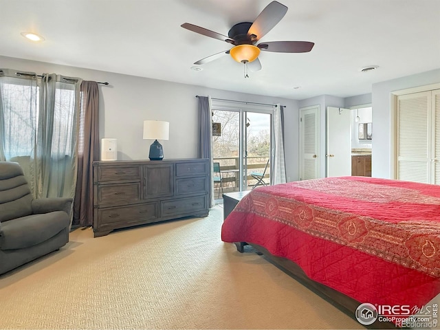 bedroom featuring access to exterior, two closets, recessed lighting, light colored carpet, and a ceiling fan