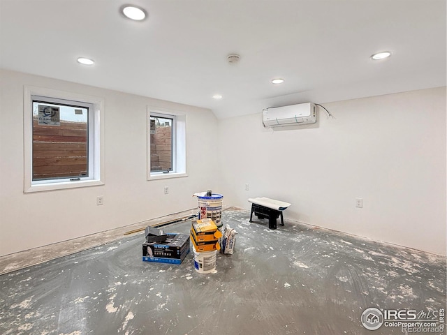 below grade area with a wall mounted AC and recessed lighting