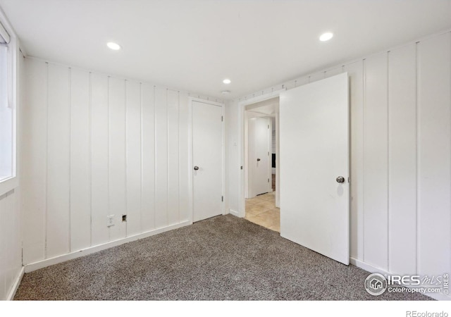 carpeted empty room featuring recessed lighting