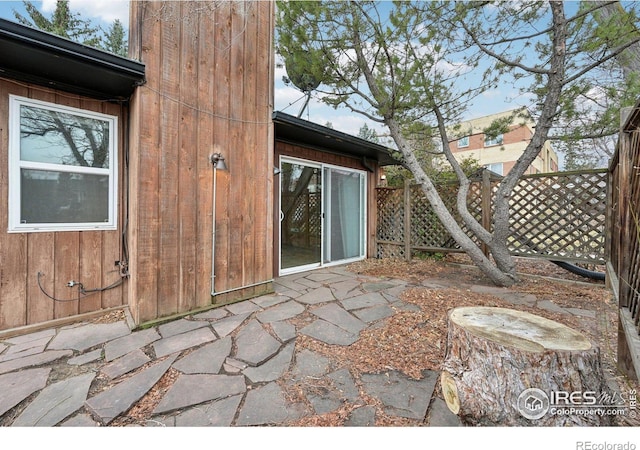 view of patio featuring fence