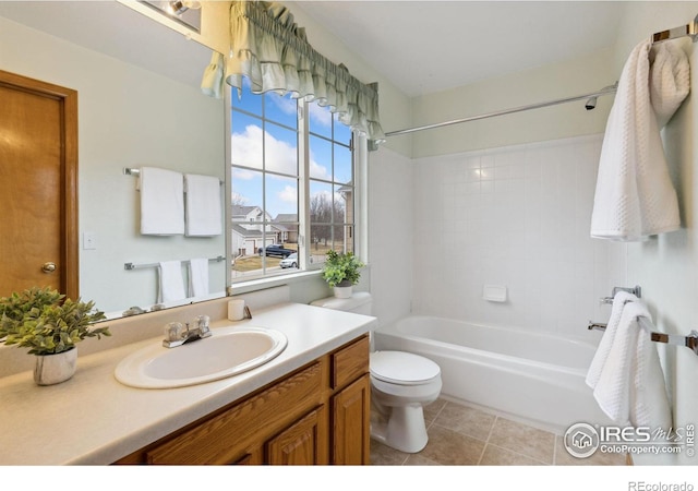 full bath featuring bathtub / shower combination, vanity, toilet, and tile patterned floors