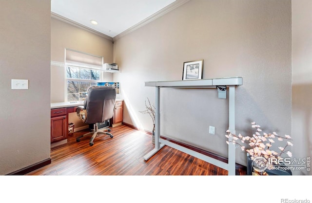 home office with baseboards, wood finished floors, and crown molding