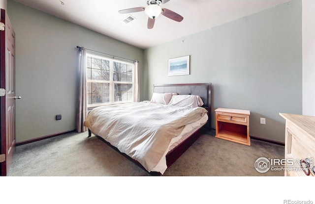 bedroom featuring ceiling fan, carpet floors, visible vents, and baseboards