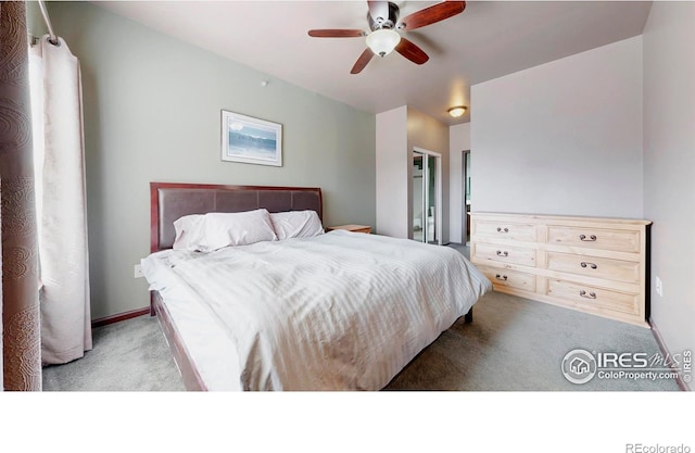 carpeted bedroom featuring a ceiling fan and baseboards