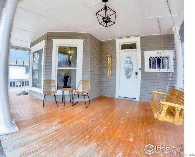 doorway to property featuring a porch