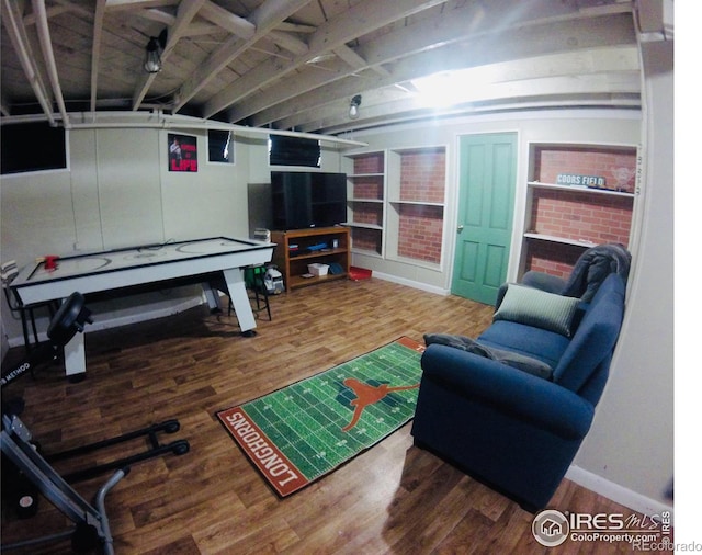 playroom featuring wood finished floors and baseboards