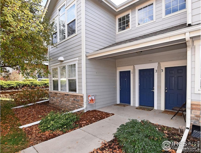 view of exterior entry with stone siding