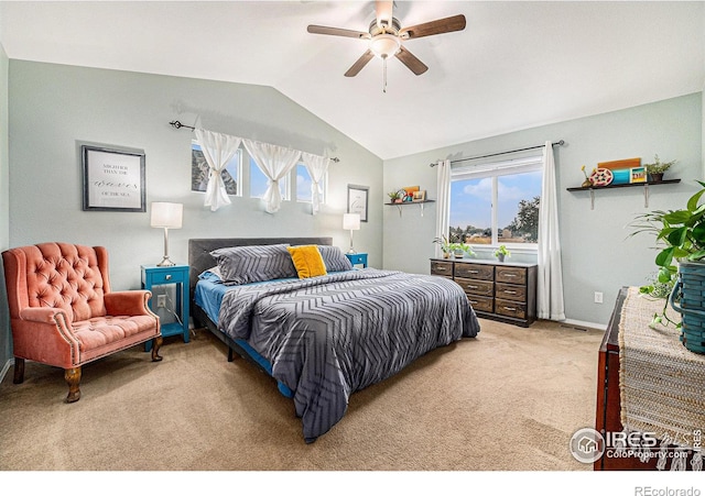 bedroom featuring light carpet, lofted ceiling, a ceiling fan, and baseboards