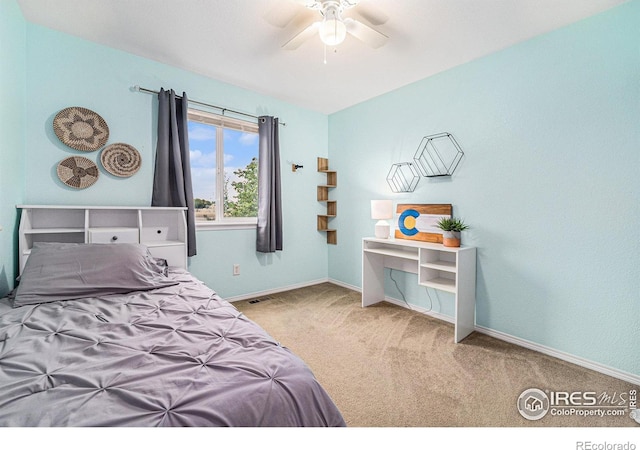 bedroom featuring carpet floors, visible vents, ceiling fan, and baseboards