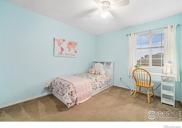 carpeted bedroom featuring a ceiling fan and baseboards