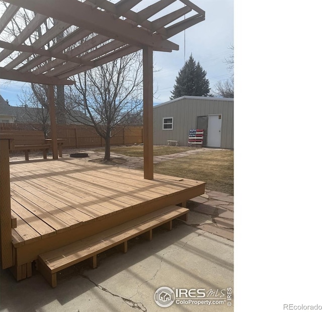 deck featuring a pergola and fence
