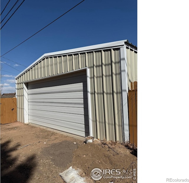 detached garage featuring driveway
