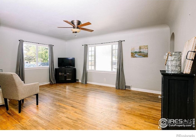 410 Cottonwood Ave, Eaton, CO 80615 - living area featuring light wood-style flooring, ceiling fan, and baseboards