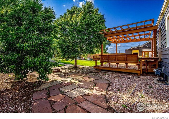410 Cottonwood Ave, Eaton, CO 80615 - view of patio featuring a pergola and a wooden deck