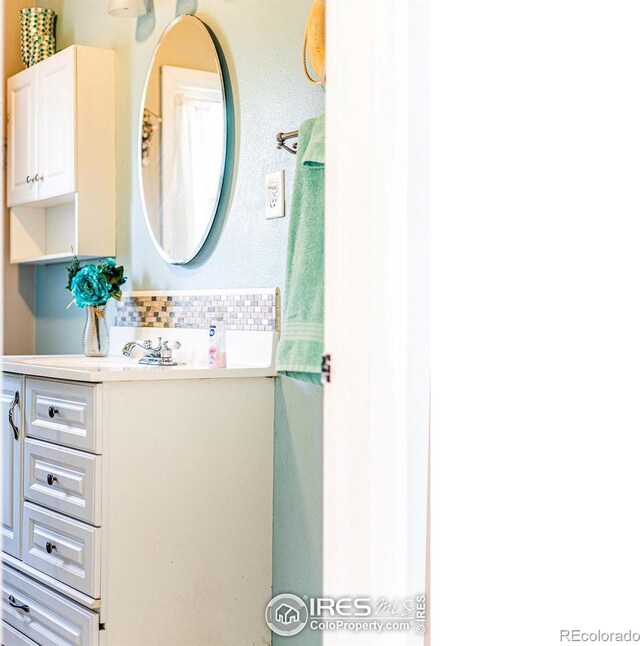 410 Cottonwood Ave, Eaton, CO 80615 - bathroom featuring tasteful backsplash and vanity