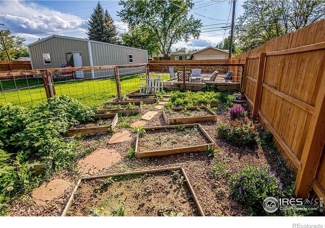 410 Cottonwood Ave, Eaton, CO 80615 - view of yard featuring a vegetable garden